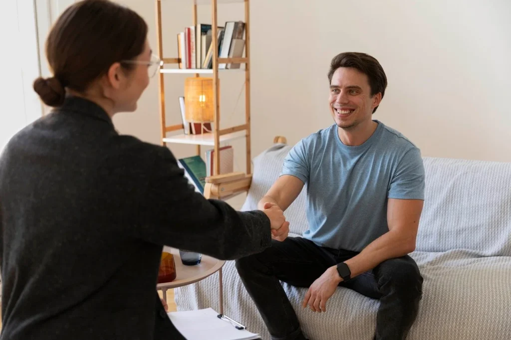 Adult family members sitting together with a licensed family therapist in a confidential counseling session during family therapy in McKinney